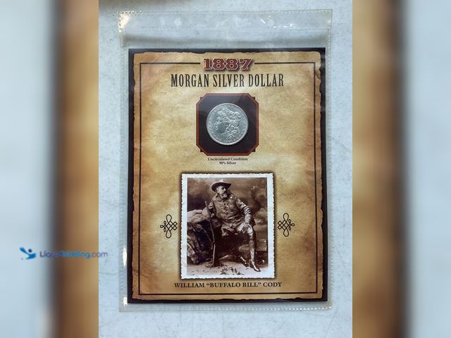 Lot 49-1505551 - 1887 MORGAN 90% SILVER DOLLAR UNCIRCULATED CONDITION WITH STAMP “WILLIAM BUFFALO BILL CODY” IN A NIC...