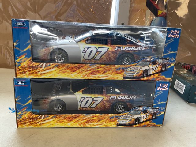 Lot 49-1830642 - COLLECTIBLE LOT OF 2 2007 FUSION FORD RACING 1/24 SCALE DIECAST CARS IN ORIGINAL BOXES #COINS0219