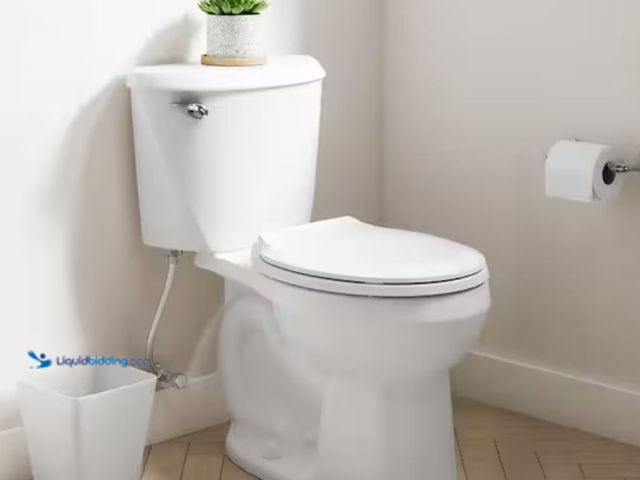 Lot 49-1623613 - American Standard Reliant 12 in. Rough In 2-Piece 1.28 GPF Single Flush Round Toilet with Slow Close...