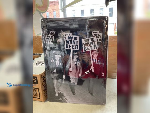 Lot 49-1505257 - COLLECTIBLE NEW METAL COLLECTOR SIGN “WE WANT BEER” MEASURES APPROXIMATELY 12 INCH BY 16 INCH #COINS...