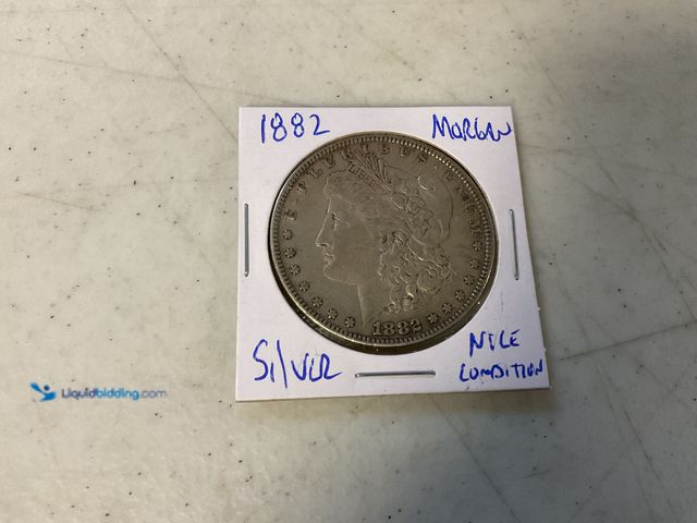 Lot 49-1811318 - 1882 MORGAN SILVER ONE DOLLAR COIN 90% SILVER