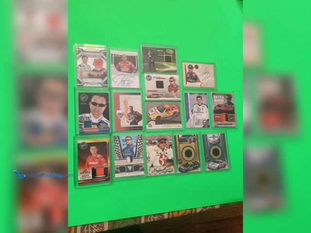 Lot 49-1913840 - 15- COLLECTIBLE NASCAR AUTOGRAPHED AND RACE USED MATERIAL RACING CARDS. VARIOUS BRANDS AND YEARS PRO...