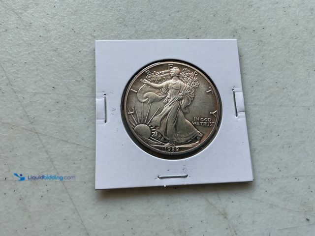 Lot 49-1804333 - 1989 SILVER EAGLE DOLLAR COIN.