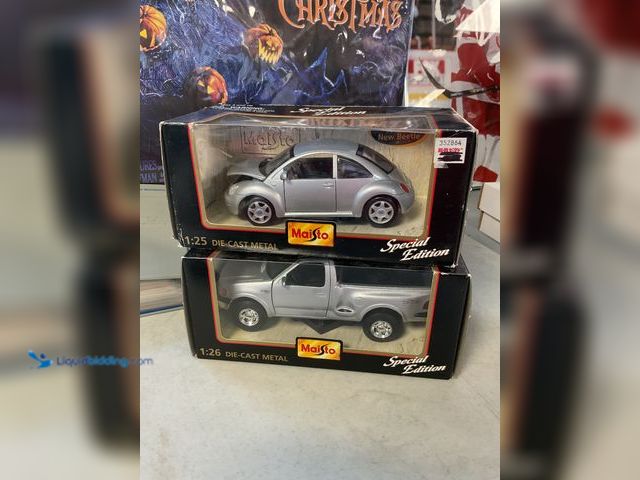 Lot 49-1505539 - COLLECTIBLE LOT OF 2 MAISTO SPECIAL EDITION 1/25 AND 1/26 SCALE DIECAST CARS IN ORIGINAL BOXES INCLU...