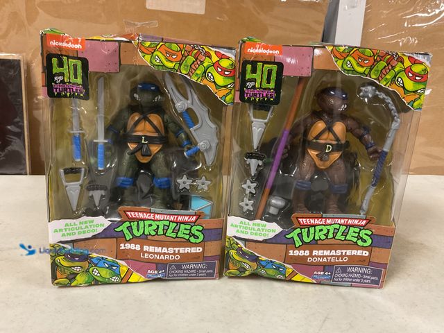 Lot 49-1505614 - COLLECTIBLE LOT OF 2 TEENAGE MUTANT NINJA TURTLES ACTION FIGURES IN ORIGINAL BOXES INCLUDING 1988 RE...