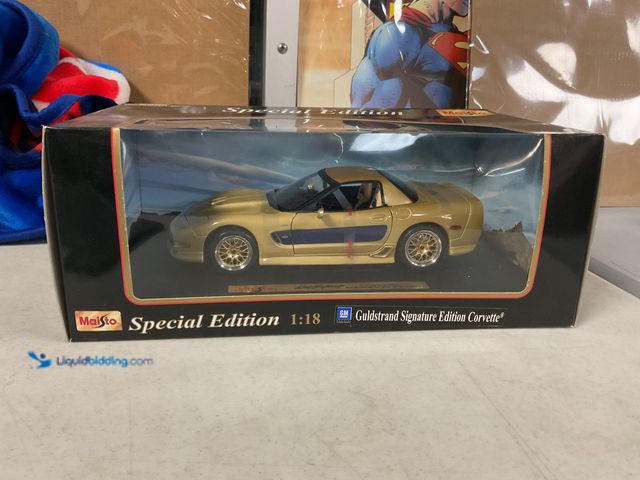 Lot 49-1830722 - COLLECTIBLE MAISTO SPECIAL EDITION 1/18 SCALE DIECAST CAR IN ORIGINAL BOX GM GULDSTRAND SIGNATURE ED...