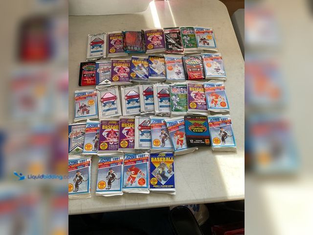 Lot 49-1505069 - COLLECTIBLE TABLE LOT OF SPORT WAX PACKS ALL SEALED FROM VARIOUS YEARS AND TYPES INCLUDING SCORE, TO...