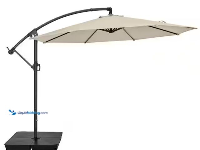 Lot 49-2005989 - StyleWell 10 ft. Steel Cantilever Market Patio Umbrella in Putty, Model # IT20597A-S-SE, Used, Has a...