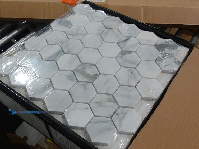 Lot 49-2024917 - Approx. (9) Sq. Ft. of  MSI Calacatta Cressa 12.38 x 12.38 in. Honed Hexagon Mosaic Tile with Distin...