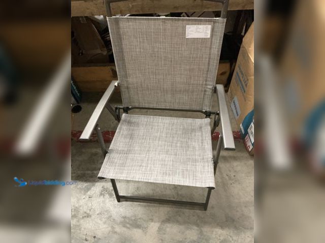 Lot 49-5549741 - outdoor folding lawn chair, khaki, 19"wide seat, 16" deep seat, 24" tall back. Unused