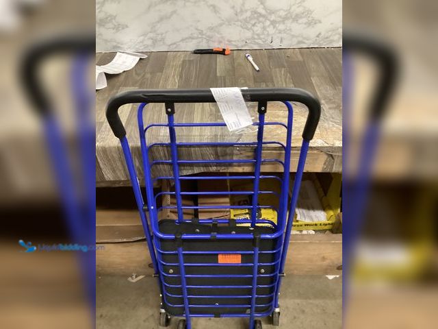 Lot 49-5407312 - Milwaukee Steel Shopping Cart in Blue with Accessory Basket. Used, slightly bent