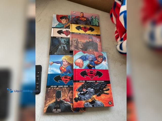 Lot 49-1830493 - COLLECTIBLE LOT OF 4 SUPERMAN BATMAN HARDCOVER VOLUMES 1-4 BOOKS PRE-OWNED CONDITION #COINS0219