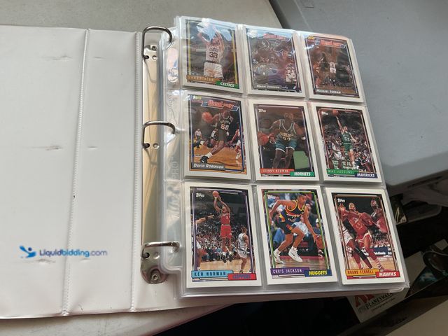 Lot 49-1804635 - BINDER FULL OF 1992-93 TOPPS BASKETBALL CARDS.