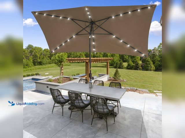 Lot 49-5416095 - Sonkuki Solar LED 10 ft. x 6.5 ft. Patio Rectangle Market Umbrella in Taupe with Push-Button Tilt. [...