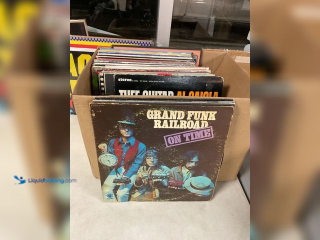 Lot 49-1505459 - COLLECTIBLE LARGE BOX FULL OF PRE-OWNED VINYL RECORDS FROM VARIOUS YEARS AND GENRES INCLUDING GRAND ...
