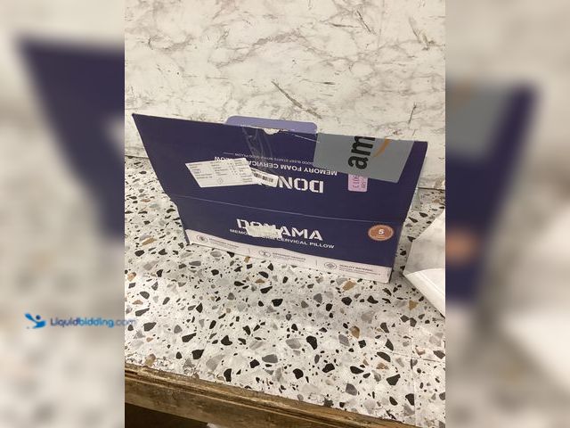 Lot 49-5460728 - Domama Memory Foam Cervical Pillow Item is unused.