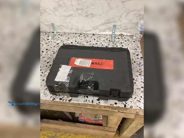 Lot 49-5460395 - Comoware Toolkit with Battery and Charger Item is used.