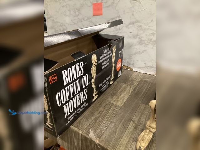 Lot 49-5436807 - Animatronics Bones Coffin Co Movers sound & motion activated walks & plays music. Unused.