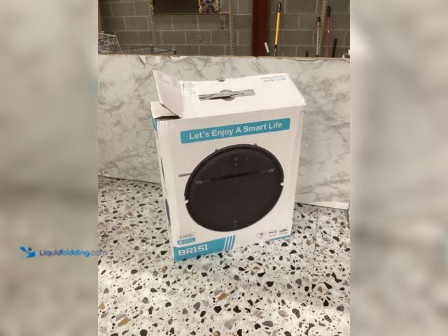 Lot 49-3527933 - BR151 Robot Vaccum 230ML Water Tank Item is used with charger and attachments, powers on.