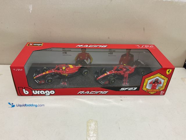 Lot 49-1977889 - Other BURAGO NEW FORMULA 1 RACING 1/24 SCALE DIECAST SF-23 FERRARI TEAM WITH 2 DRIVER FIGURES INCLUD...