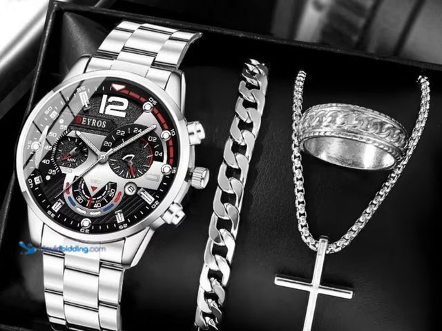 Lot 49-1831693 - 4pcs Men'
Watch &amp; Jewelry Set - Quartz Analog Watch with Date Display, Matching Ring, Bracelet &...