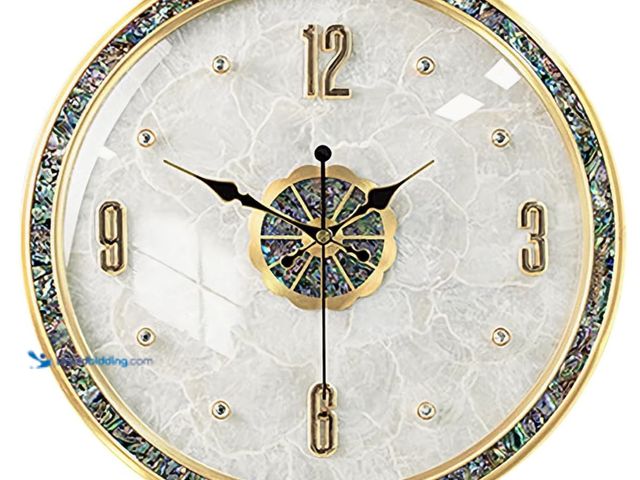 Lot 49-2026400 - Ergocar Natural shell wall clock. Model #B0D223HPV3. MSRP: $104.941. Unused.