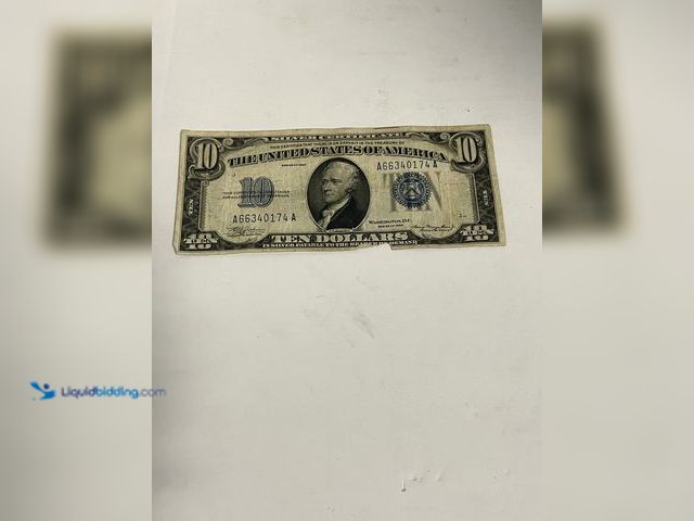 Lot 49-910572 - Series 1934 $10 Silver Certificate featuring the iconic blue Treasury seal and serial numbers. This ...