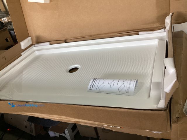 Lot 49-3631292 - DreamLine SlimLine 54 in. x 32 in. Single Threshold Alcove Shower Pan Base in White with Center Drai...