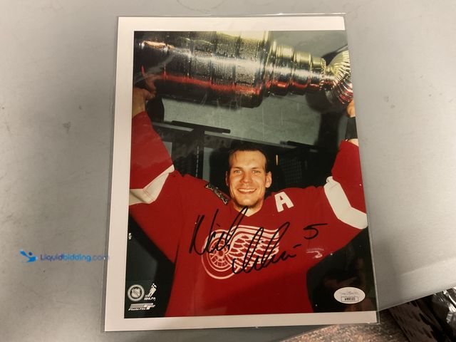 Lot 49-1505939 - WOW! AUTOGRAPHED 8X10 BY THE ONE AND ONLY NICKLAS LIDSTROM WITH JSA COA. AMAZING AUTOGRAPH FOR ANY C...