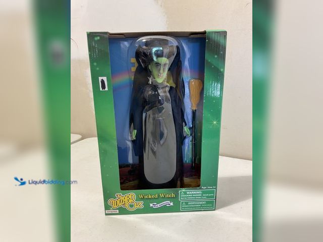 Lot 49-3609291 - Other THE WIZARD OF OZ ‘WICKED WITCH” FASHION DOLL IN ORIGINAL BOX 85TH ANNIVERSARY SEALED BOX