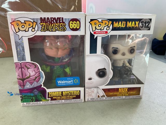 Lot 49-1811255 - COLLECTIBLE 2 FUNKO POP FIGURES IN ORIGINAL PACKAGES, ZOMBIE MYSTERIO #660 AND NUX #512