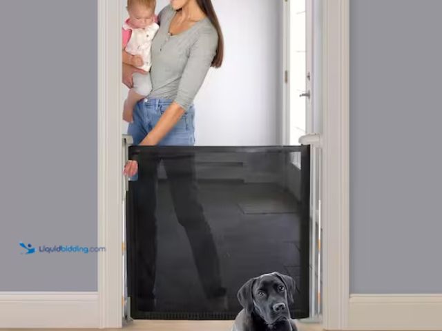 Lot 49-1567562 - INGENUITY The Thruway 52W Series Pet and Baby Retractable Gate with Tuck Away Mesh, Hardware Mounted...