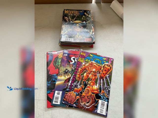 Lot 49-5341801 - LOT OF 20 COLLECTIBLE COMIC BOOKS FROM DC, MARVEL AND MORE INCLUDING XMAN, SUPERMAN, X-MEN, WOLVERIN...