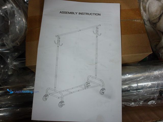 Lot 49-1555639 - Garment Rack with Bottom Storage, Silver, Slightly used, Scuffs and Scratches.  Ref#BULK1126