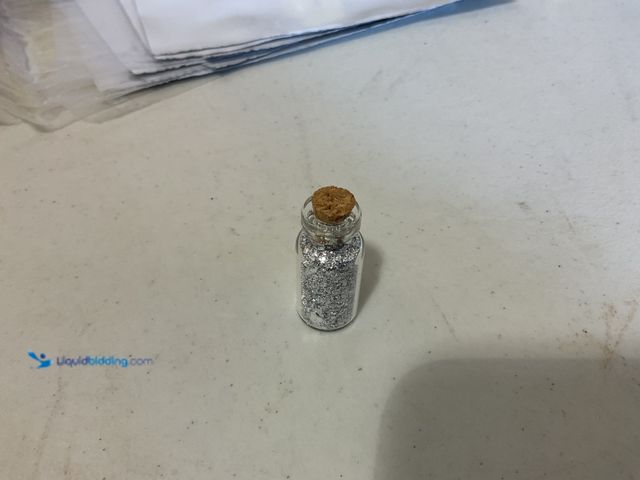 Lot 49-5515682 - RARE ONE INCH GLASS VILE OF PURE SILVER FLAKES