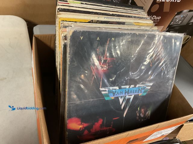Lot 49-1505608 - COLLECTIBLE LARGE BOX FULL OF PRE-OWNED VINYL RECORDS VARIOUS GENRES AND ARTISTS INCLUDING VAN HALEN...