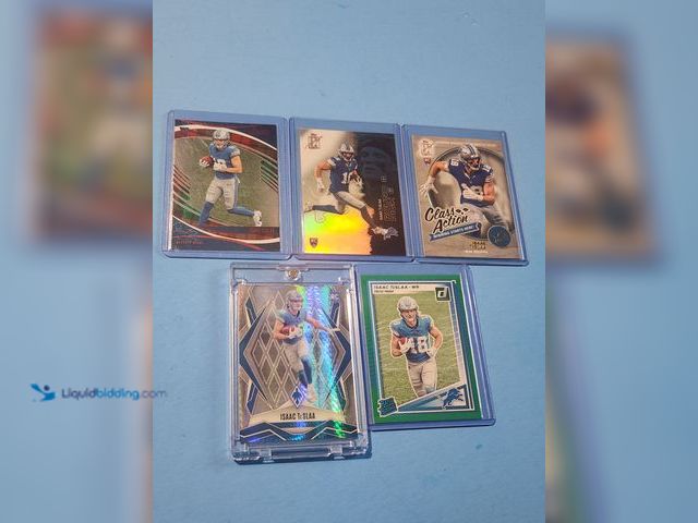 Lot 49-1817771 - 5- COLLECTIBLE ISSAC TESLAA ROOKIE FOOTBALL CARDS. VARIOUS BRANDS INCLUDES REFRACTORS AND GREEN PRES...