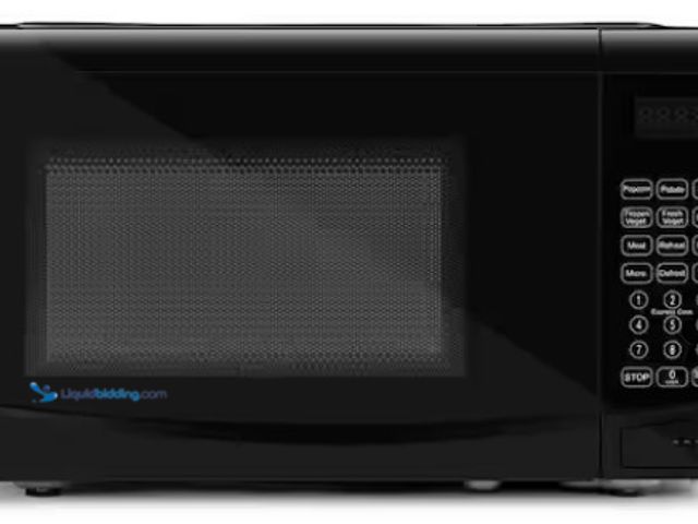 Lot 49-5476392 - Continental Electric 0.7 Cubic Feet Countertop Microwave in Black. Item is Unused (scuffs & scratche...