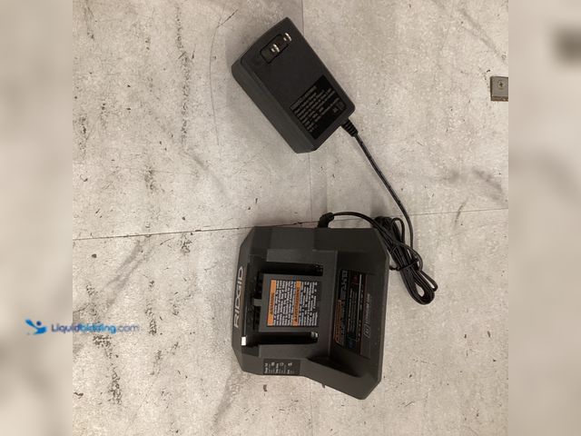 Lot 49-3565336 - Ridgid 18v Lithium- Ion battery charger. CHARGER ONLY Model # AC9302