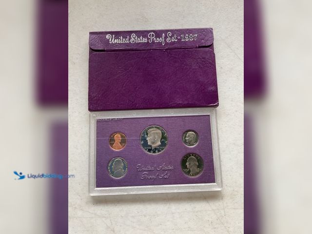 Lot 49-3503732 - 1987 UNITED STATES PROOF SET 5 COINS IN HARD PLASTIC CASE AND ORIGINAL SLEEVE