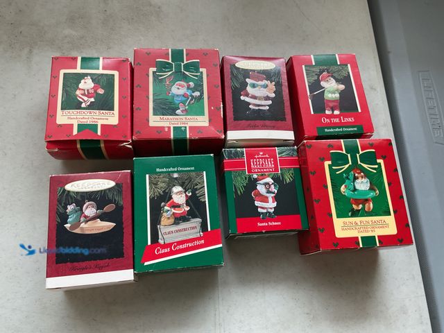 Lot 49-1505040 - COLLECTIBLE LOT OF 8 VINTAGE HALLMARK KEEPSAKE ORNAMENTS IN ORIGINAL BOXES INCLUDING TOUCHDOWN SANTA...
