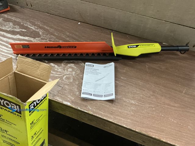 Lot 49-5554167 - RYOBI Expand-It 18 in. Universal Hedge Trimmer Attachment Model # RYHDG Unused