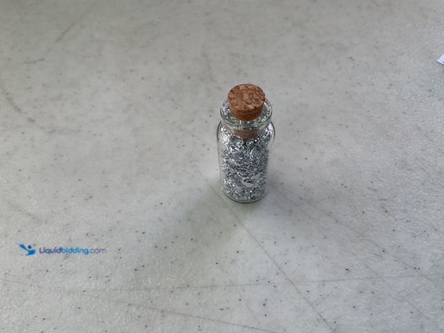 Lot 49-1810331 - ONE INCH GLASS VILE OF PURE SILVER FLAKES