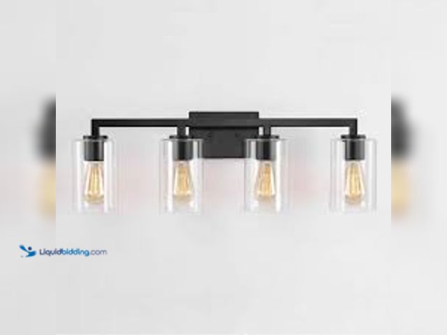 Lot 49-5438170 - KAWOTI 28.75 in. 4-Light Matte Black Vanity Light with Clear Glass Shade. Model # 21221. Unused