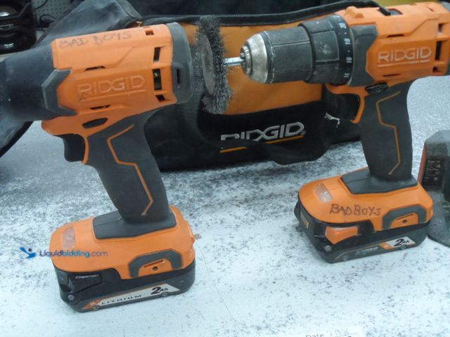 Lot 49-1820131 - 2 Ridgid R86001, R86002 Battery Powered 2 PC. Drill Set Ridgid 18 Volt 2 Drill Set Both Used In Fair...