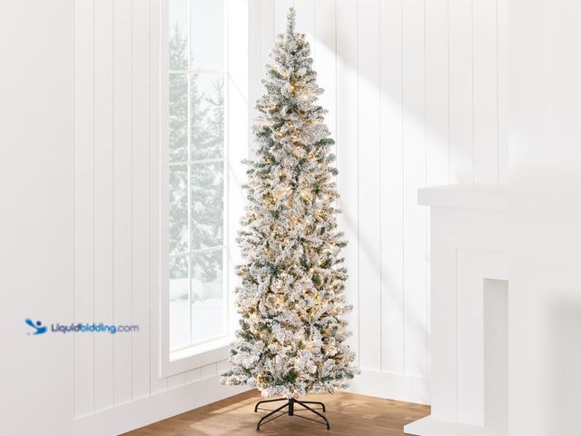 Lot 49-1546951 - 7-7.5FT Pencil Flocked Tree, Pre-Lit in Warm White, Artificial, Green, Tested works, Powers on.   Re...