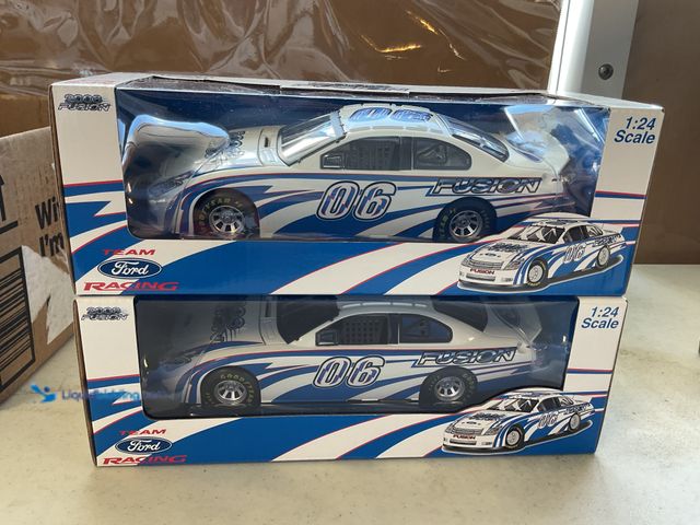 Lot 49-3503991 - LOT OF 2 FORD RACING 2006 FUSION 1/24 SCALE DIECAST CARS IN ORIGINAL BOXES