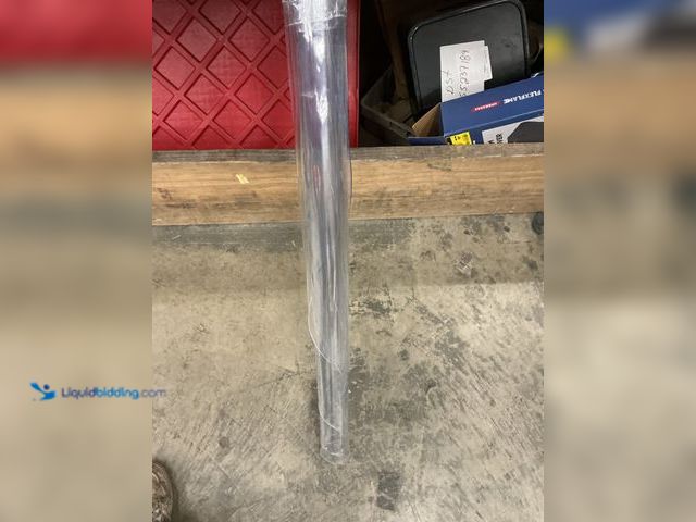 Lot 49-5485888 - Round clear plastic rug for under office chairs. Medium size. Used with scuffs and scratches.