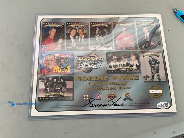 Lot 49-1820859 - COLLECTIBLE AUTOGRAPHED GORDIE HOWE 8X10 DETROIT RED WINGS UPPER DECK 65TH BIRTHDAY PHOTO SHEET IN H...