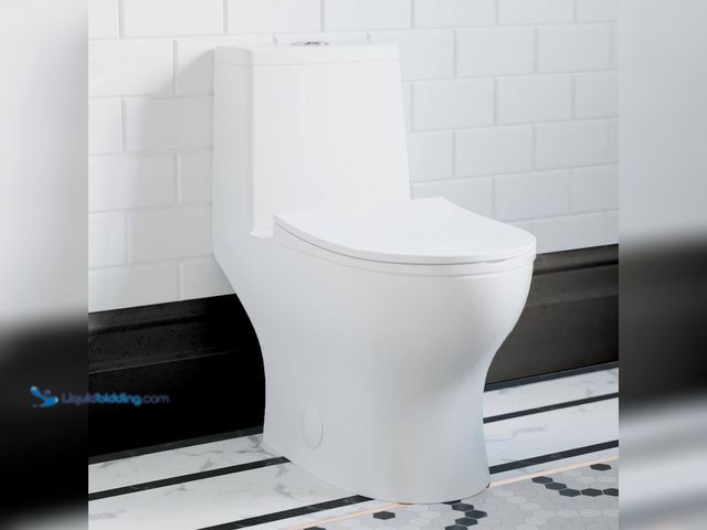 Lot 49-5408408 - Swiss Madison 1-piece 1.1 GPF Ivy 10 in. Rough-In Dual Flush Elongated Toilet in White Seat Included...
